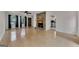 Bright living room with hardwood floors, stone fireplace, and sliding doors to the outside deck at 178 Castleair Ne Dr, Kennesaw, GA 30144