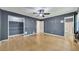 Large bedroom with hardwood flooring and attached closet and bathroom at 178 Castleair Ne Dr, Kennesaw, GA 30144