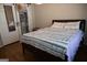Relaxing bedroom featuring hardwood floors, a cozy bed, and closet at 37 La Rue Nw Pl, Atlanta, GA 30327