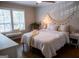 Cozy bedroom with natural light, wood floors, and bohemian accents at 37 La Rue Nw Pl, Atlanta, GA 30327