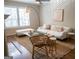 Bright living room featuring a comfy sofa, soft rug, and floor lamp at 37 La Rue Nw Pl, Atlanta, GA 30327