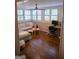 Sunlit living room with a cozy seating area and desk space, blending comfort and functionality seamlessly at 37 La Rue Nw Pl, Atlanta, GA 30327