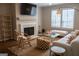 Cozy living room with fireplace, neutral decor, and a glass coffee table at 37 La Rue Nw Pl, Atlanta, GA 30327