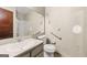 Compact bathroom featuring a toilet, shower, and sink at 70 Juliana Dr, Ellenwood, GA 30294