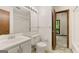 A bathroom featuring a vanity, toilet, and a mirror with Hollywood lights at 70 Juliana Dr, Ellenwood, GA 30294