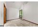 Bright bedroom features a window providing natural light and neutral carpet throughout at 70 Juliana Dr, Ellenwood, GA 30294