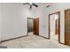 This bedroom has neutral carpet and wooden doors for a homey feel at 70 Juliana Dr, Ellenwood, GA 30294