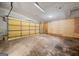 Spacious garage with yellow door and a concrete floor at 70 Juliana Dr, Ellenwood, GA 30294