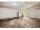 A garage with stained concrete floors and a water heater at 70 Juliana Dr, Ellenwood, GA 30294