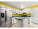 Kitchen featuring stainless steel refrigerator, white cabinets, and an island at 70 Juliana Dr, Ellenwood, GA 30294