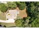 Aerial shot showing a large house with backyard deck surrounded by lush green trees at 3045 Moss Stone Lane Sw Ln, Marietta, GA 30064