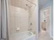 Bathroom featuring a tiled shower with a tub and showerhead and access to another bathroom at 3045 Moss Stone Lane Sw Ln, Marietta, GA 30064