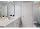 Bright bathroom featuring a large vanity, white cabinets, and a framed mirror at 3045 Moss Stone Lane Sw Ln, Marietta, GA 30064