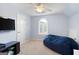 Cozy bedroom featuring a beanbag chair, a window with shutters, and blue painted walls at 3045 Moss Stone Lane Sw Ln, Marietta, GA 30064