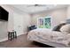 Comfortable bedroom features a ceiling fan, large window, and neutral decor at 3045 Moss Stone Lane Sw Ln, Marietta, GA 30064
