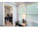 Bedroom featuring a large window and ample storage space in the adjacent walk-in closet at 3045 Moss Stone Lane Sw Ln, Marietta, GA 30064