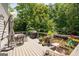 Spacious deck is ready for outdoor dining with a grill, seating, and nature views at 3045 Moss Stone Lane Sw Ln, Marietta, GA 30064