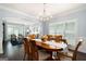 Elegant dining room featuring modern chandelier and open layout with bright, airy feel at 3045 Moss Stone Lane Sw Ln, Marietta, GA 30064