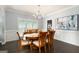 Elegant dining room featuring modern chandelier and large window with bright, airy feel at 3045 Moss Stone Lane Sw Ln, Marietta, GA 30064
