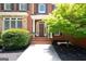 Beautiful entrance featuring a wooden door, brick steps, and lush landscaping at 3045 Moss Stone Lane Sw Ln, Marietta, GA 30064