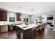 Gourmet kitchen with an island, seating, wine fridge, and an open floor plan into the living room at 3045 Moss Stone Lane Sw Ln, Marietta, GA 30064