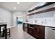 Kitchen features stainless steel appliances, floating shelving, and wine fridge, and opens to living area at 3045 Moss Stone Lane Sw Ln, Marietta, GA 30064