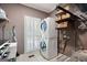 Well-organized laundry room featuring a stacked washer/dryer and ample storage space at 3045 Moss Stone Lane Sw Ln, Marietta, GA 30064