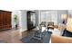 Inviting living room featuring hardwood floors, large windows, and stylish contemporary furniture at 3045 Moss Stone Lane Sw Ln, Marietta, GA 30064