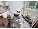 Open-concept living room featuring hardwood floors, large windows, and natural light at 3045 Moss Stone Lane Sw Ln, Marietta, GA 30064