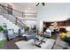 Open living room floor plan that features hardwood floors and a view of the staircase at 3045 Moss Stone Lane Sw Ln, Marietta, GA 30064