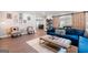 Cozy living room featuring two sitting chairs, an area rug, and a blue sofa with cushions at 3045 Moss Stone Lane Sw Ln, Marietta, GA 30064