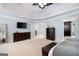 Spacious main bedroom with tray ceilings, carpet floors, and a seating bench offers a relaxing retreat at 3045 Moss Stone Lane Sw Ln, Marietta, GA 30064