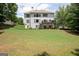 Rear exterior view showcases a spacious backyard, patio, and deck perfect for entertaining at 3045 Moss Stone Lane Sw Ln, Marietta, GA 30064