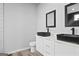 Modern bathroom featuring dual vanities, matte black fixtures, and contemporary lighting at 569 Middle Sw St, Atlanta, GA 30310