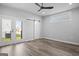 Bright bedroom with patio access through double doors and a view of the exterior at 569 Middle Sw St, Atlanta, GA 30310