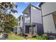 Modern home featuring balconies, stylish siding, and a well-maintained lawn at 569 Middle Sw St, Atlanta, GA 30310