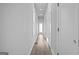 Bright hallway with recessed lighting and neutral walls, leading to a glass-paned back door at 569 Middle Sw St, Atlanta, GA 30310