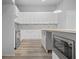 Well-equipped kitchen featuring stainless steel appliances, an island with microwave, and minimalist design at 569 Middle Sw St, Atlanta, GA 30310