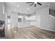 Open living space with modern design elements, featuring hardwood floors and seamless kitchen integration at 569 Middle Sw St, Atlanta, GA 30310
