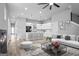 Bright, modern living room flowing into a sleek kitchen with island seating and stylish decor at 569 Middle Sw St, Atlanta, GA 30310