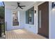 Inviting porch with ceiling fan, stylish lighting, and a modern front door, creating a welcoming entrance at 569 Middle Sw St, Atlanta, GA 30310