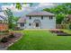 Backyard features a stone patio, hot tub, privacy fence, and well-maintained lawn and landscaping at 10980 Pinehigh Dr, Alpharetta, GA 30022