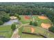 Aerial view of baseball and sports fields, featuring multiple fields for baseball and other activities at 10980 Pinehigh Dr, Alpharetta, GA 30022