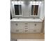 Bathroom vanity with double sinks, granite countertop, and recessed lighting at 10980 Pinehigh Dr, Alpharetta, GA 30022