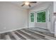 Kitchen nook with wood-look flooring, ceiling fan, and large windows at 10980 Pinehigh Dr, Alpharetta, GA 30022