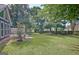 Spacious backyard with mature trees and greenery offers a serene outdoor retreat at 110 Chesterfield Ct, Fayetteville, GA 30214