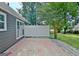 Gray house featuring a white fence and concrete patio in backyard at 110 Chesterfield Ct, Fayetteville, GA 30214