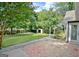 A spacious backyard features a shed, greenery, and a concrete patio at 110 Chesterfield Ct, Fayetteville, GA 30214