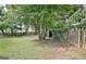 Expansive backyard features mature trees, a rustic fence, and plenty of space for outdoor activities at 110 Chesterfield Ct, Fayetteville, GA 30214