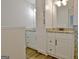 Bathroom featuring double sinks with granite countertops and white cabinets at 110 Chesterfield Ct, Fayetteville, GA 30214